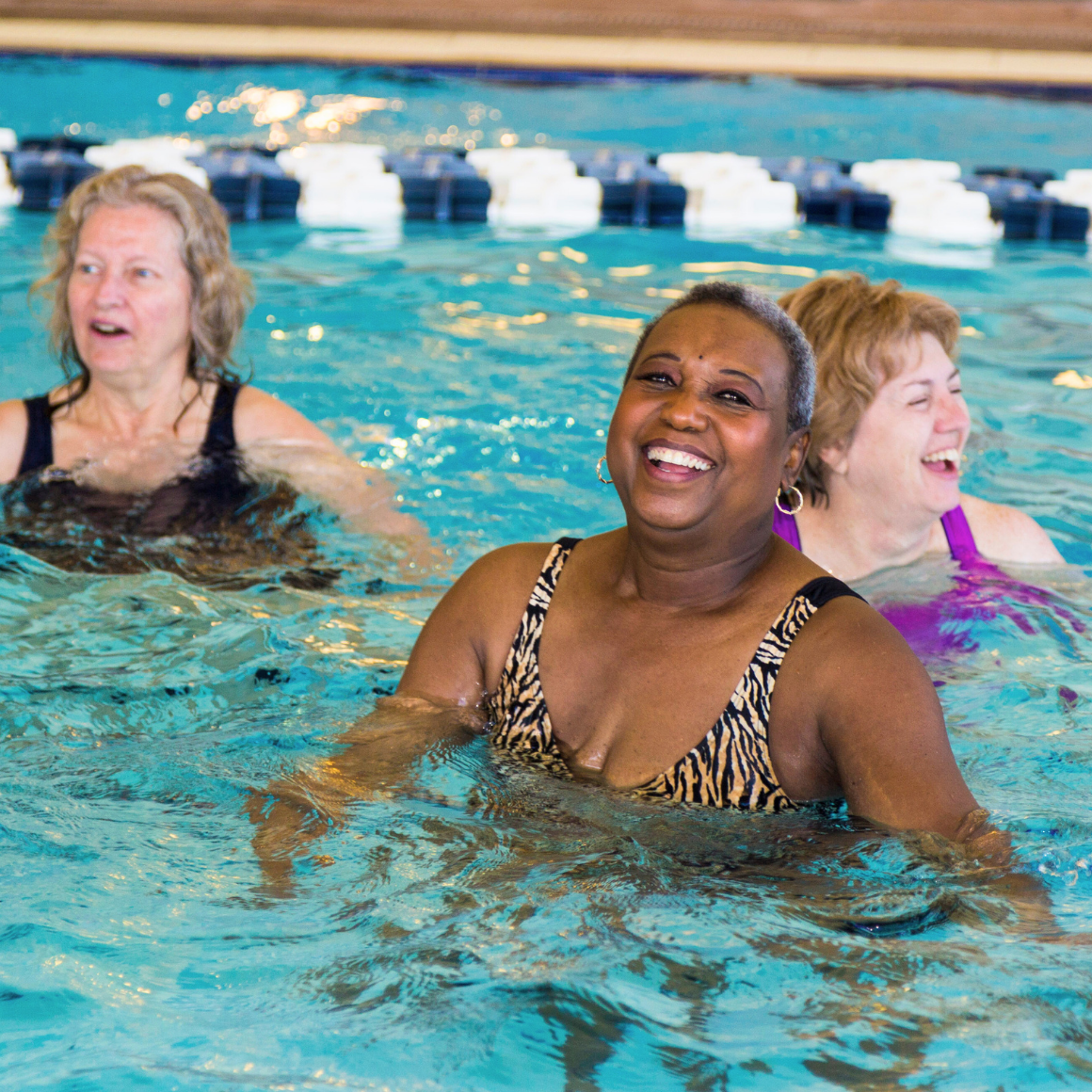 3 ladies having fun in the water at aqua fitness