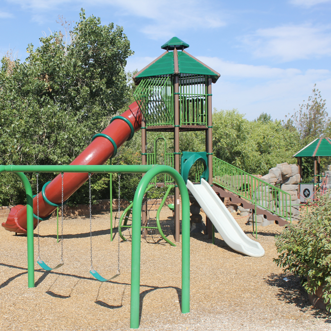 Piney Creek Hollow Park | 3 story playground structure, slides, and swingset