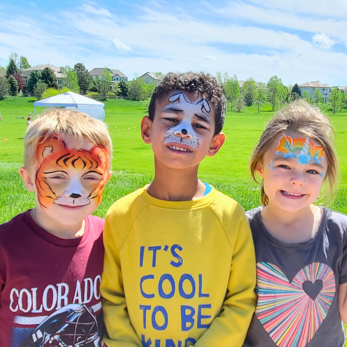 TPRD Special Events: Summer Celebration | 3 young kids with face paint on in the shape of a tiger, dog, and unicorn.