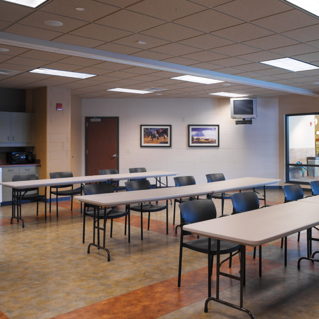 Conestoga Room Rental | 3 tables with 4 chairs set up in one of the Trails Rec Center's rentable rooms