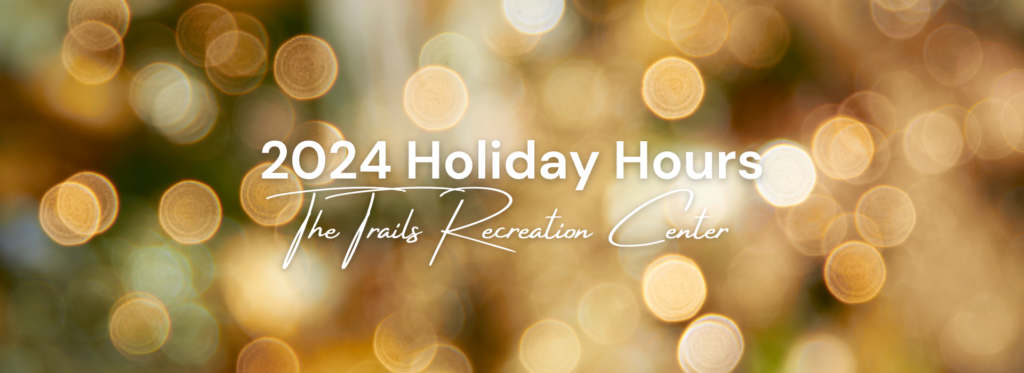 Trails Recreation Center 2024 Holiday Hours written over out of focus christmas lights