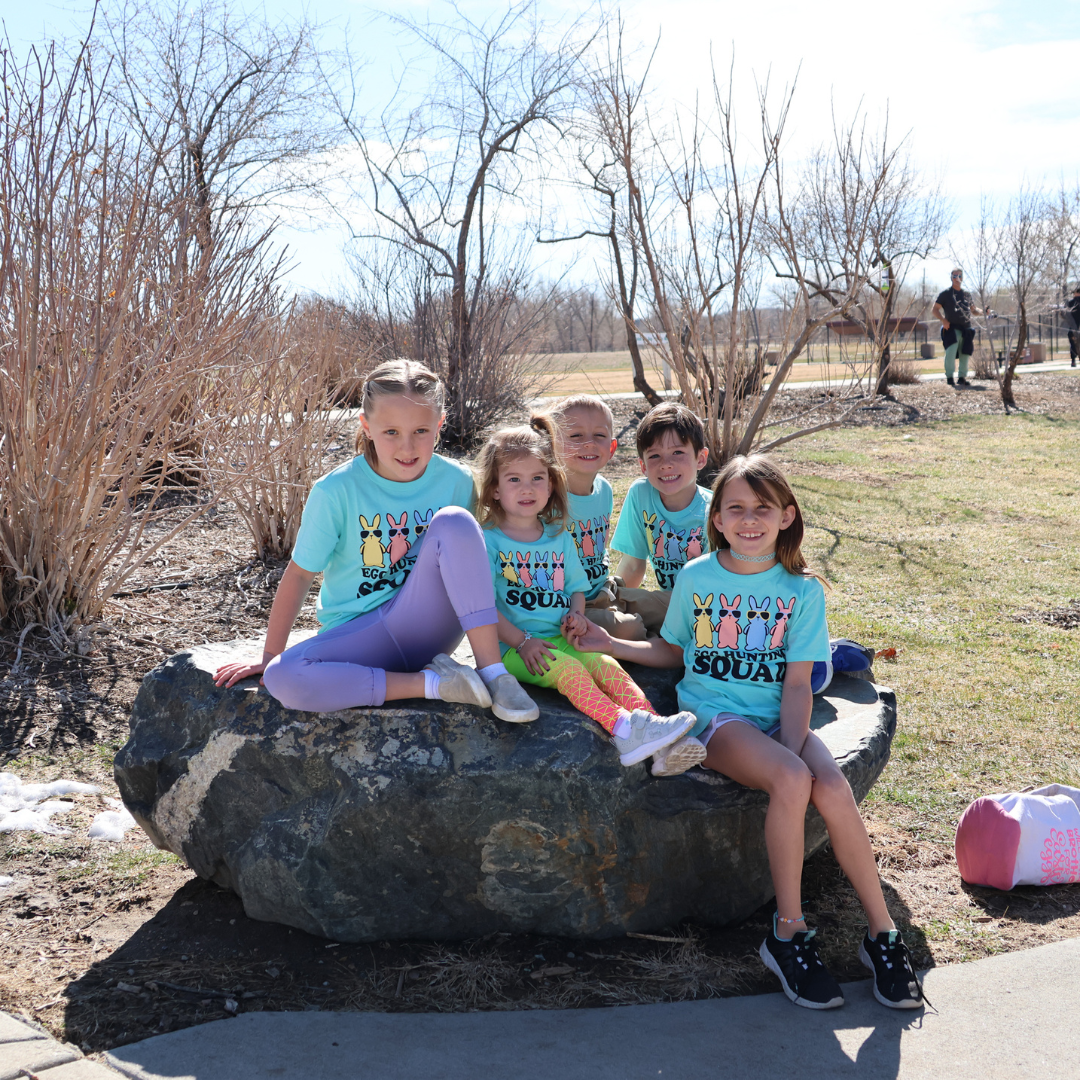 Easter Egg Hunt | group of children wearing matching "egg hunting squad" shirts