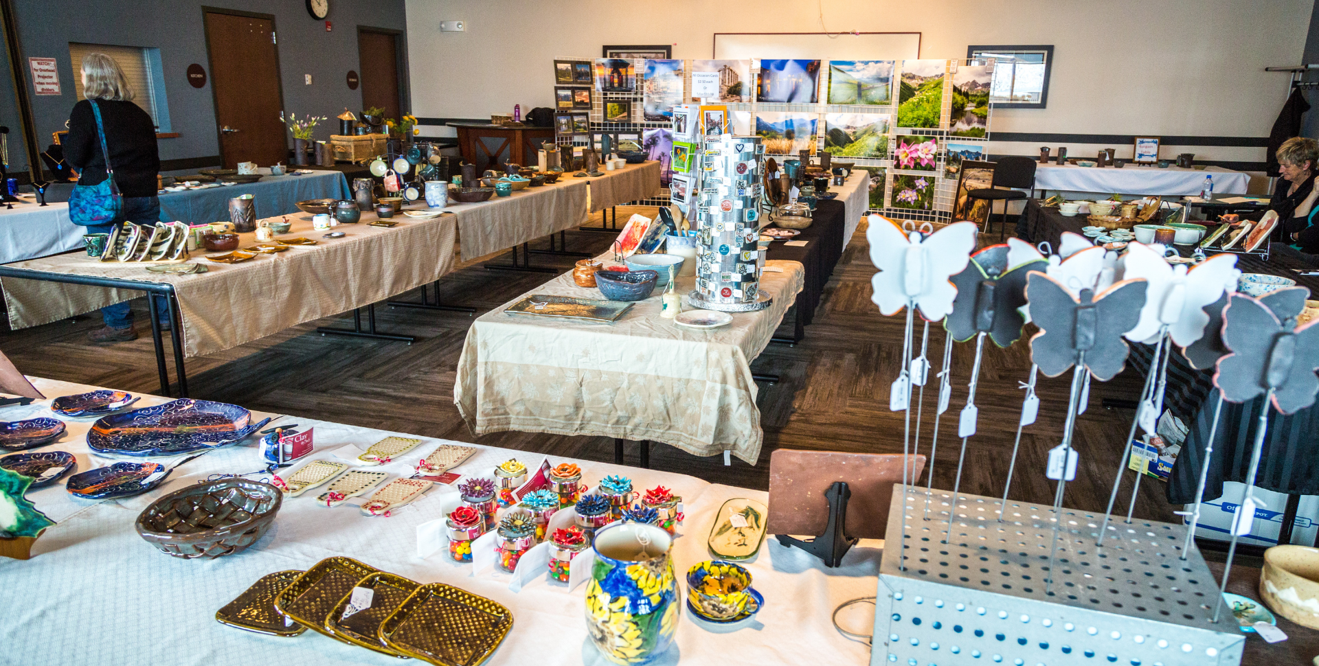 Spring Pottery Sale Header | tables set up with different art, pottery, and crafts