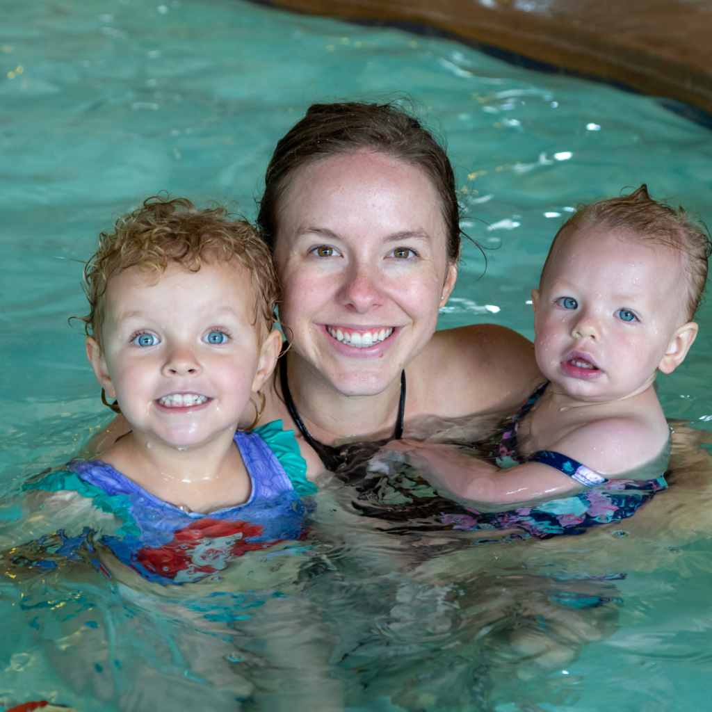 Gyms with Swimming Pools | A mom and 2 young kids participating in a swimming lesson