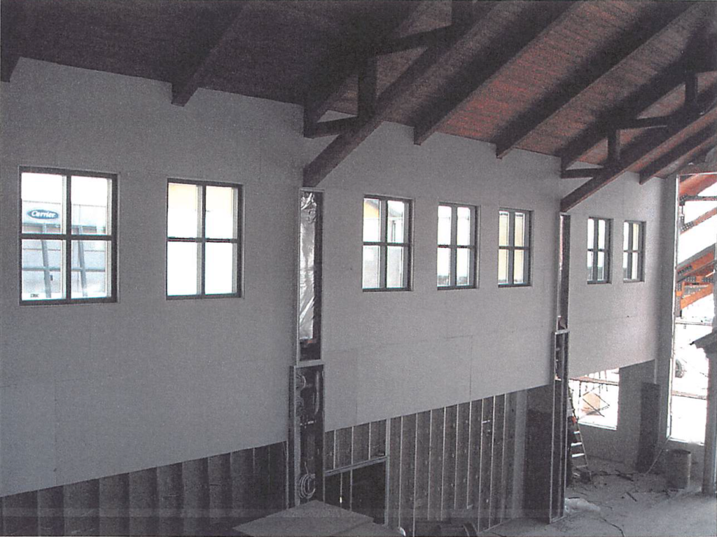 April 2004 | Drywall and window installation at main lobby in progress