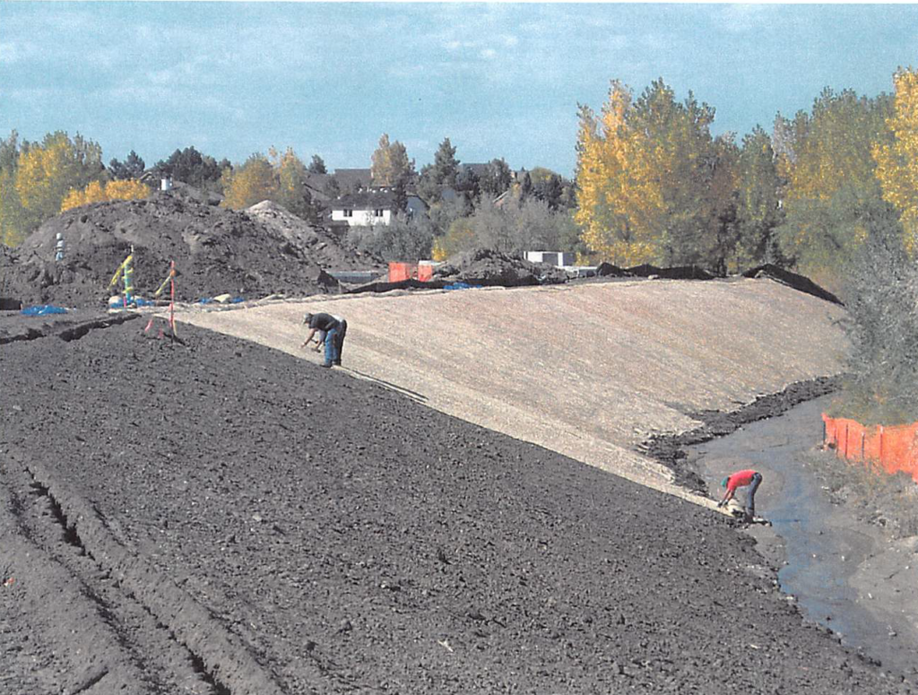 October 2003 Construction Pictures: erosion control blanket on Piney Creek being installed