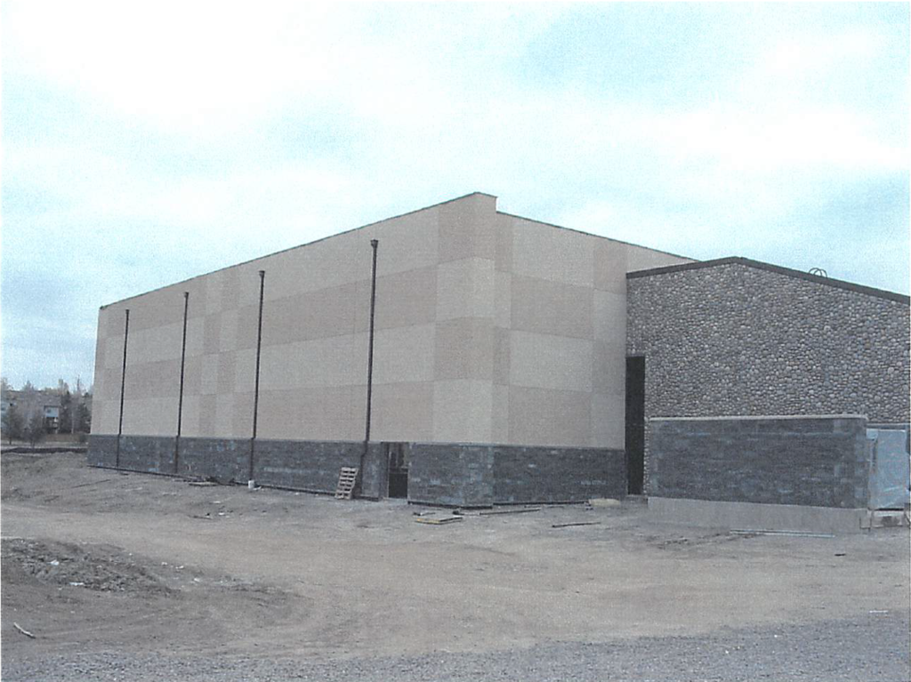 March 2004 Gym wall EFIS complete. Stone work at racquetball courts also complete