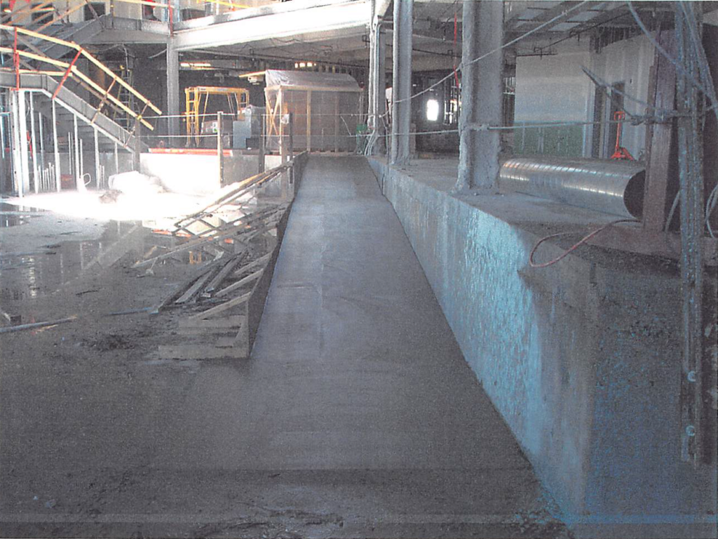 April 2004 | Ramp down to fitness floor has been poured