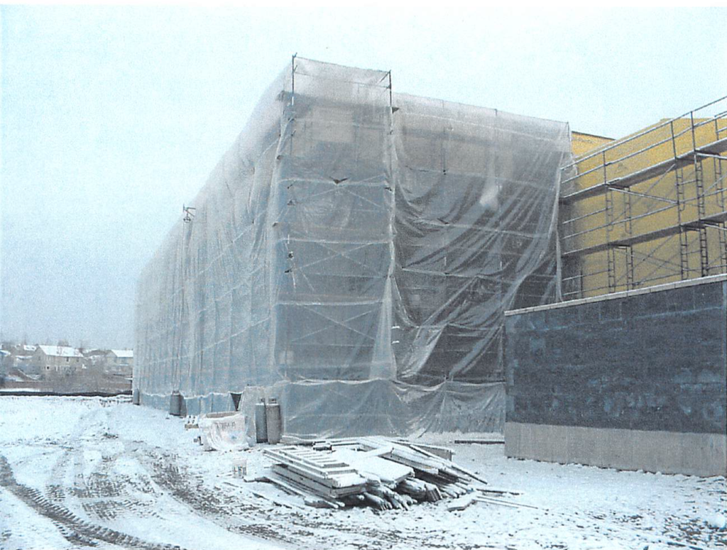 February 2004 Temporary weather enclosure at exterior gym wall for masonry and EFIS installation