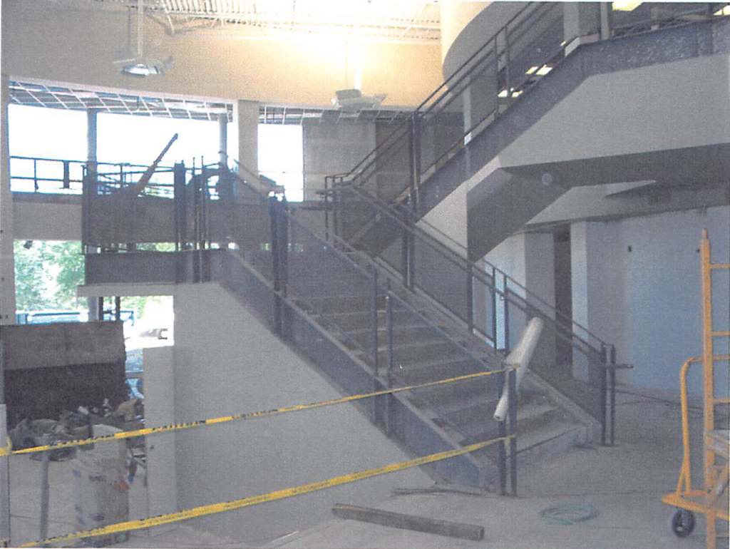 June 2004 | Main fitness area stair railings in progress and light fixtures installed