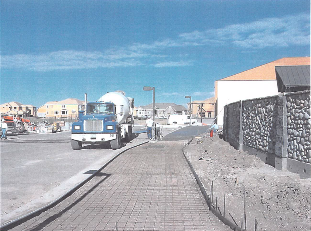 July 2004 | Sidewalk concrete pours in progress south of kid's area patio